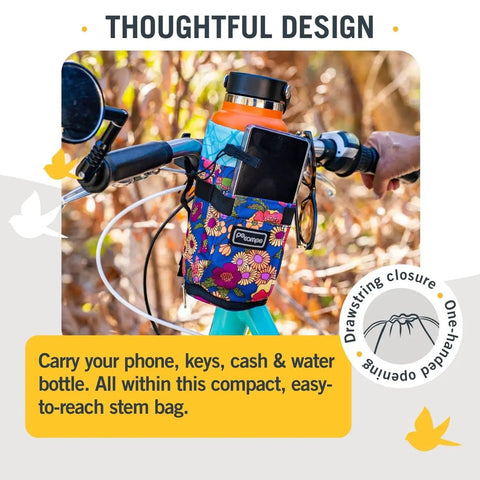Willis Stem Bag For Bike Handlebar holding a water bottle, phone in floral print, attached to bike handlebar with drawstring closure.