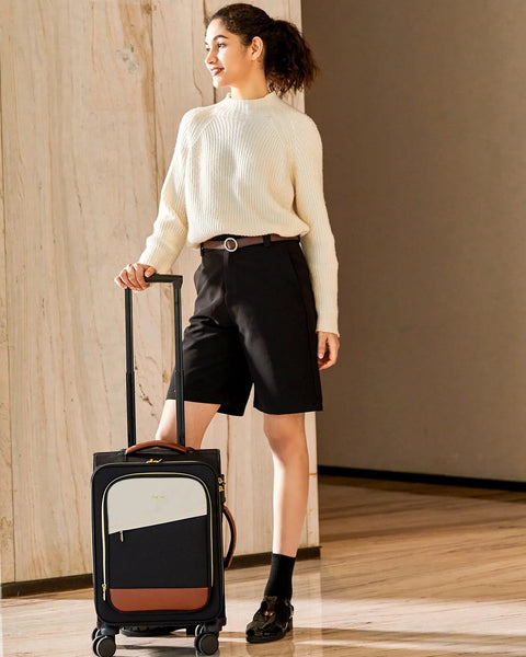 Front view of LoveVOOK carry-on rolling suitcase with extended handle; navy body, cream front panel, brown base.