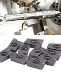 Beefy Carbide Turning Inserts For CNC Lathes, 10 Pack Model APMT1605PEER XM LF6018 displayed below CNC machining setup.