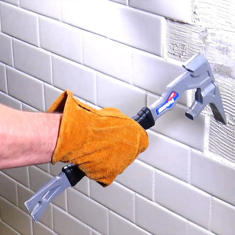 15 Inch Multi Function Demolition Tool Nail Puller With Cross Hatch Hammer in use breaking tile by a gloved hand