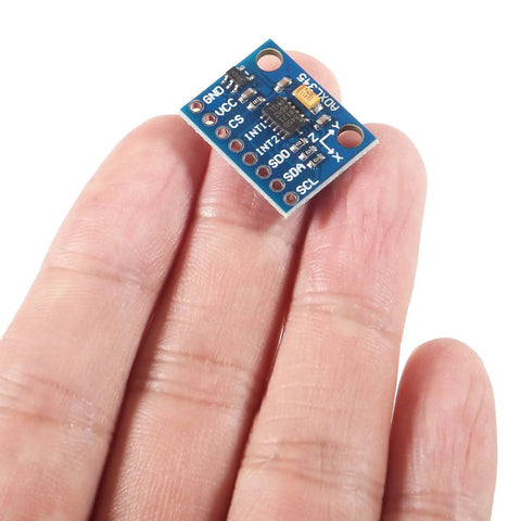 Close-up of GY 291 3 Axis Accelerometer Module with I2C and SPI for Arduino ADXL345 Digital Tilt Sensor in hand