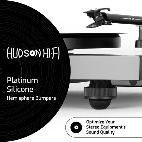 Turntable with one of the 8-Pack 0.75-Inch Platinum Silicone Speaker Isolation Pads For Speakers Subwoofers And Turntables installed.