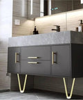 Modern bathroom vanity with V shaped metal furniture legs and marble countertop
