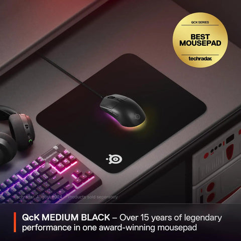 QcK Medium Gaming Mouse Pad With Non Slip Silicone Rubber Base For Peak Tracking And Pro Grade Game Ready Sensor Performance 320 By 270 mm For FPS MOBAs RTS MMO showing mouse on desk setup