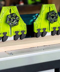 Two lime-green BOW FencePRO FP4 featherboards with EVA fingers mounted on a table saw fence