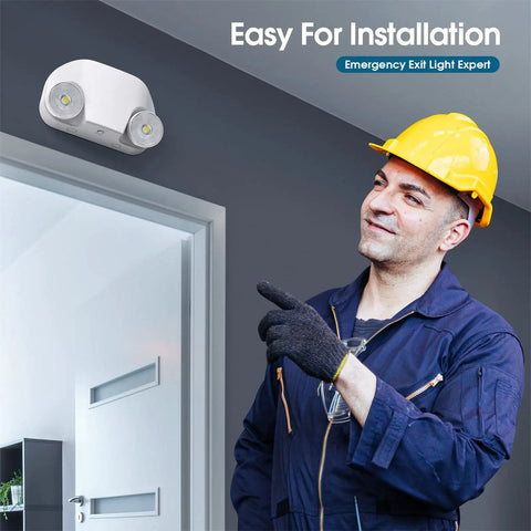 Installer pointing at LED Emergency Light With Remote Capable And Adjustable Lamp Heads For Exit Lighting, Backup Battery Power, 120V-277V Dual Voltage