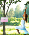 Go To Medicine Lock Box For First Aid And Family Use With Safe Key Lock Durable Aluminum Layered Medicine Cabinet Pink Finish Secure 12.2 By 7.9 By 7.5 Inch Meds Storage hanging on tree near woman practicing yoga