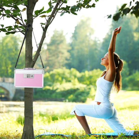 Go To Medicine Lock Box For First Aid And Family Use With Safe Key Lock Durable Aluminum Layered Medicine Cabinet Pink Finish Secure 12.2 By 7.9 By 7.5 Inch Meds Storage hanging on tree near woman practicing yoga