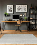 Modern office with wood frames, desk, and chair, showcasing Heavy Duty Picture Hanging Kit For Wood Frames And Canvases On Drywall