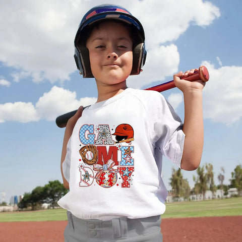 Child wearing a shirt with 10 Pack Baseball DTF Iron On Transfers For T Shirts And Apparel Ready To Press Heat Transfer Sheets design