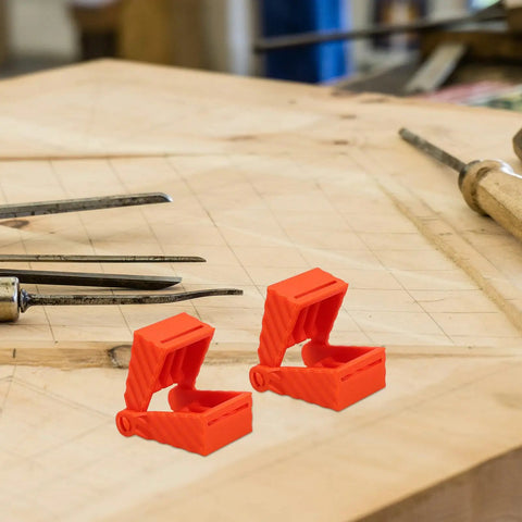4 Piece Ratchet Woodworking Strap Clamp Blocks Set on a wooden workbench, orange blocks used for quick fix band clamps.