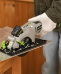 20V Cordless Mini Circular Saw With Laser Guide And Dual Blades Compact Wood Cutter with a saw in hand on wood.