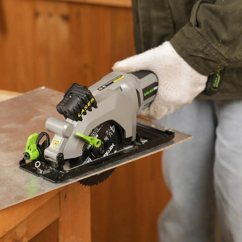 20V Cordless Mini Circular Saw With Laser Guide And Dual Blades Compact Wood Cutter with a saw in hand on wood.
