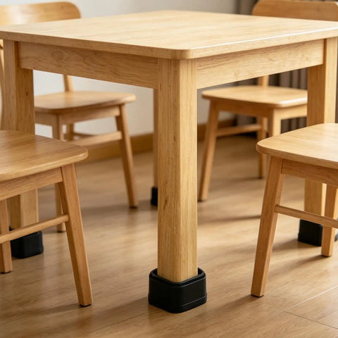 Wooden table and chairs with anti-vibration pads for heavy duty floor protection and noise reduction.
