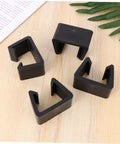 Four Pack Sturdy Chair Clips For Rattan Furniture, Sofa Fasteners And Corner Connectors, black, on wooden surface