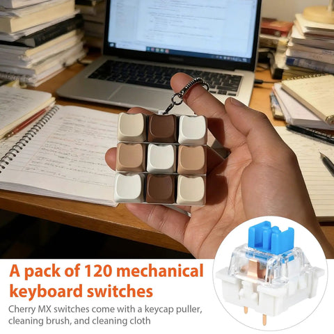 120 Pack Blue MX-Compatible 3-Pin Mechanical Keyboard Switches With Switch Puller, Cleaning Brush, And Cloth Go-To DIY Switch Kit For 3D Prints, Replacements, And Custom Keyboard Builds held in hand