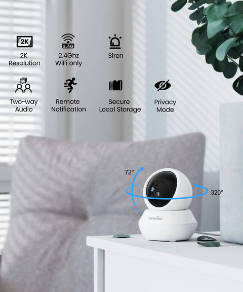 Indoor Pet Cam 2K Security Cam on table showing pan tilt control in living room, motion alerts, remote viewing via phone app.