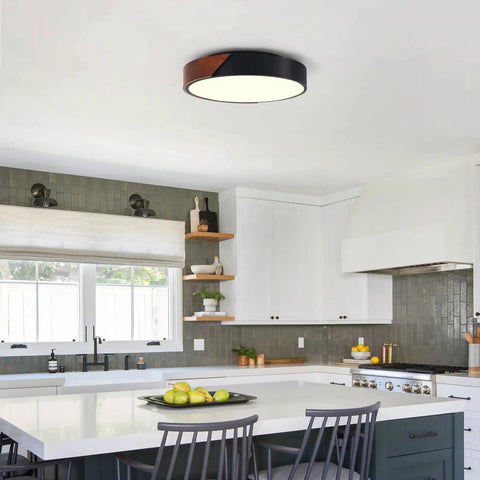 Slick Modern Black Wood Look Flush Mount Ceiling Light 3 Light Fixture in kitchen with island and stools