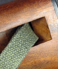Close-up of OD green webbing through rifle stock for M1 Carbine Web Sling OD Green One Inch Canvas Reproduction With Lift-The-Dot Closure WWII Style Steel Fixtures