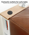 2 Inch Flush Mount Desk Power Grommet With Built In US Outlet And 3.28 Ft Heavy Duty Cord, No Sweat Desktop Power Hub mounted on a sofa table.