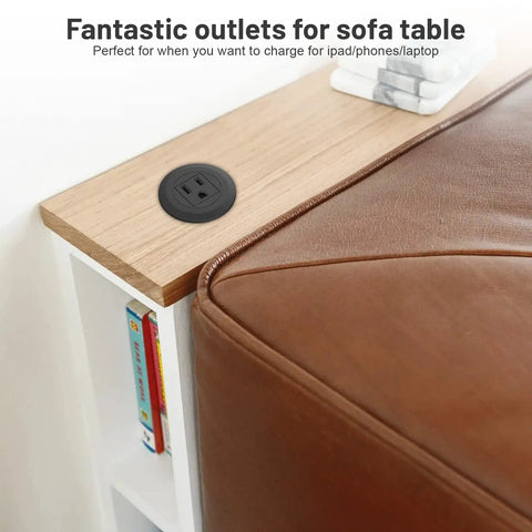 2 Inch Flush Mount Desk Power Grommet With Built In US Outlet And 3.28 Ft Heavy Duty Cord, No Sweat Desktop Power Hub mounted on a sofa table.