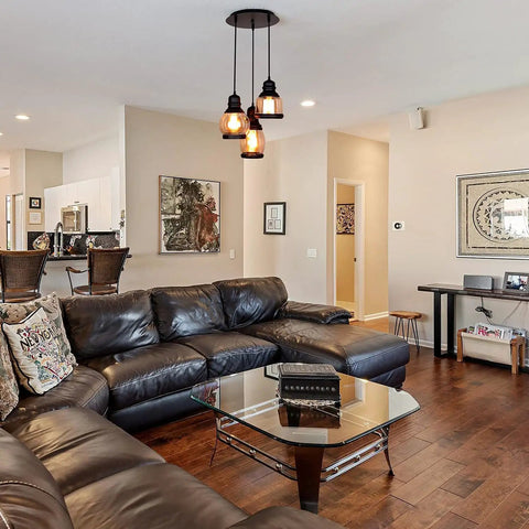 Living room with brown leather sofa, coffee table, and Vintage Farmhouse Pendant Lights Dope For Kitchen Island With 3 E26 Sockets