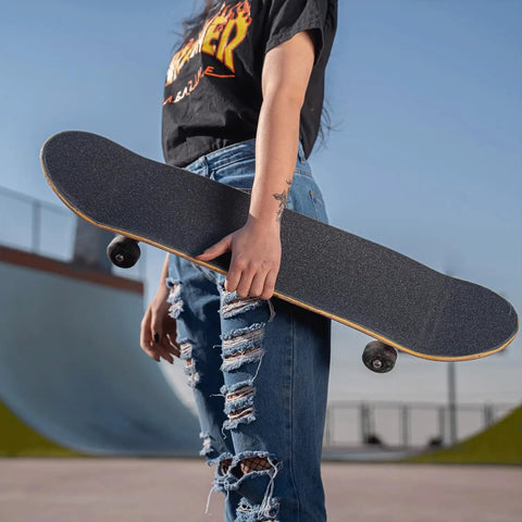 Grip Tape For Skateboards, Longboards And Scooters - Non Slip, Bubble Free Application, 110 X 27 Cm shown on skateboard outdoors