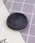 Rubber Bathtub Stopper 2pcs for Bathroom and Laundry Drain Use, showing a flat black rubber stopper with a silver rim.
