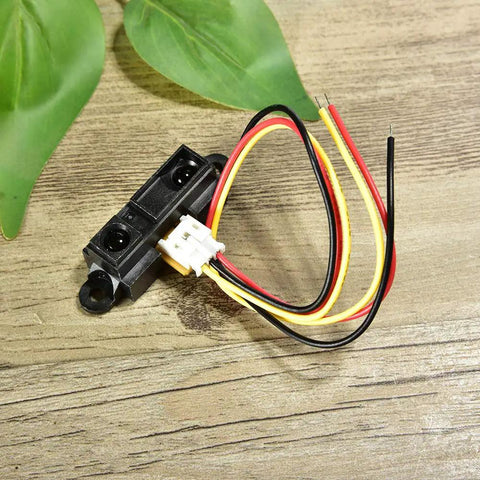 Sharp IR Analog Distance Sensor GP2Y0A21YK0F 10 To 80 Cm Cable with Arduino Pro Kit on wooden surface