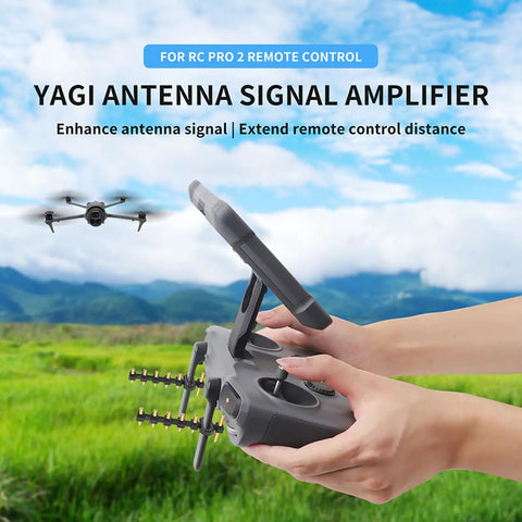 Yagi Antenna Booster For DJI RC2 And RC Pro2 Screen Controllers, signal extender held outdoors with a drone in the background