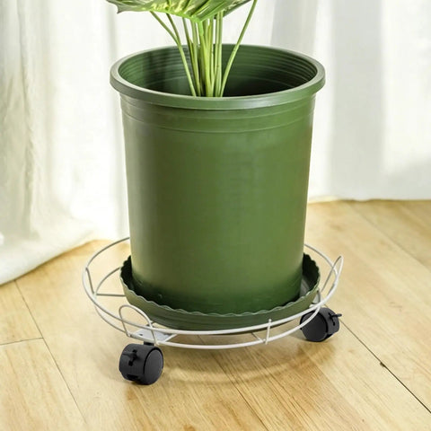 Four Pack 1.5 Inch Swivel Caster Wheels With Locking Brakes And 6.25 Millimeter Straight Stem For No Sweat Swap on green plant pot.