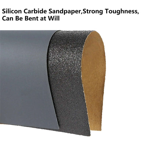 Close-up of silicon carbide sandpaper showing flexibility, part of Assorted Grit Sandpaper Sheets Kit 100 Pack 80 To 5000 Wet And Dry Sanding.