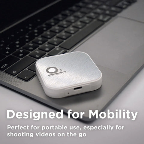 Magnetic External SSD 1TB For On The Go Storage with MagSafe Portable resting on laptop keyboard