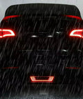 Dope Tesla Model Y Led Brake And Turn Signal Kit With Smoke Tint Lens Replaces Hitch Cover, rear view with LED lights in rain.