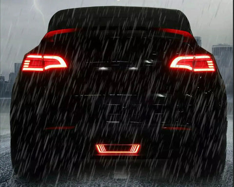 Dope Tesla Model Y Led Brake And Turn Signal Kit With Smoke Tint Lens Replaces Hitch Cover, rear view with LED lights in rain.