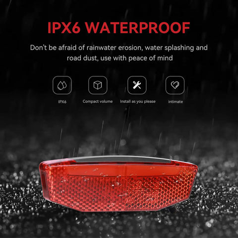 LED Bike Tail Light For Electric Bikes 6V 60V Waterproof Rear Light With 180 Degree Wide Beam in rain showcasing IPX6 waterproof feature
