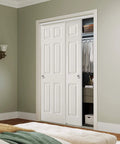 48 By 80 Inch Raised Textured Six Panel Bypass Hollow Core White Primed Sliding Closet Door With All In One Track Hardware Kit in bedroom