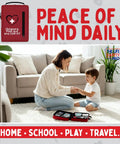 Red portable kids' first aid kit with CPR shield; two open cases on the living room rug.