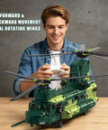 Person operating Remote Control Military Helicopter Building Blocks Set With Realistic Tandem Rotor Design RC Aircraft Model Kit