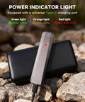 Rechargeable 1500 Lumen EDC Flashlight With 226 Meter Beam, IPX7 Waterproof, shown charging with USB-C on rocks.