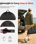 Person carrying Lightweight Folding Camping Table With 4 Cup Holders Waterproof Canvas Outdoor Table and bag by vehicle