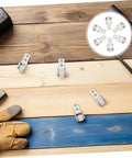 Heavy Duty Nylon Sliding Door Rollers With Smooth As Butter Ride For Cabinets And Drawer Units Features Six One Inch White Pulleys on wooden surface.