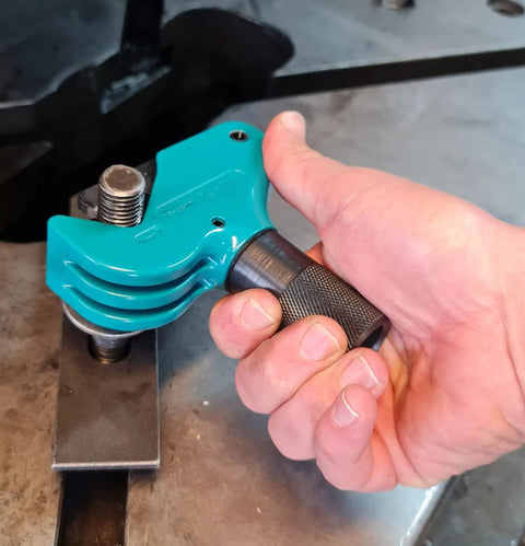 A person using the Universal Thread Repair Tool And Restorer For All Threads In Range Five Eighths Inch To One And A Half Inches External Or Internal Threads Metric And SAE One Hand Tool Quick Sizing Chases And Repairs Threads on a bolt.