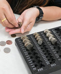 Person using Pro Grade Black Coin Counter Tray For Quick Change Count And Sort 5 Compartment Organizer to sort coins