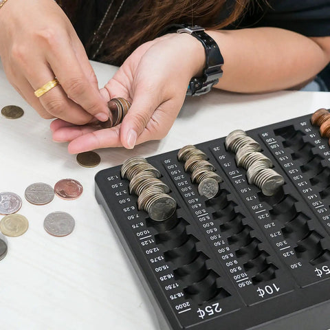 Person using Pro Grade Black Coin Counter Tray For Quick Change Count And Sort 5 Compartment Organizer to sort coins