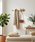 Vintage Cast Iron Bird Branch Wall Hook Dead Tough Rustic Coat Rack For Entryway Cottagecore Home Decor With Slick Gold Finish holding scarves and a bag.