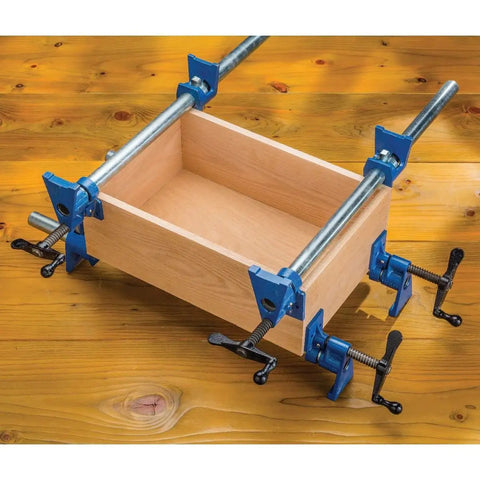 Wooden box secured with Beefy Extra Wide 3/4 Inch Pipe Clamps For Woodworking With 2-1/2 Inch Jaws on a workbench