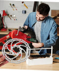 Radical Performance Mechanical Disc Brake Set For Mountain Bikes Front And Rear 160Mm Rotors shown with a mechanic installing it on a bike.