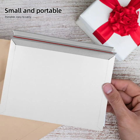 A4 Gray White Self Sealing Paper Mailing Envelopes Thickened For Documents And Photos 30 Pack shown handheld with gift box nearby