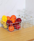 Set Of 4 White Wire Storage Baskets For Freezer, Pantry, And Bathroom Organization, 8.75 W X 11 L X 4.8 H bins holding fruits and glasses
